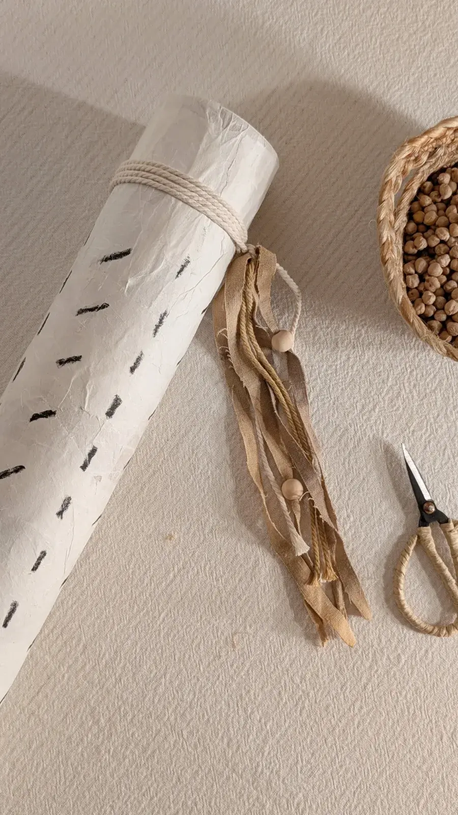 Handmade sensory rain maker designed to create gentle rain sounds for quiet sensory play.