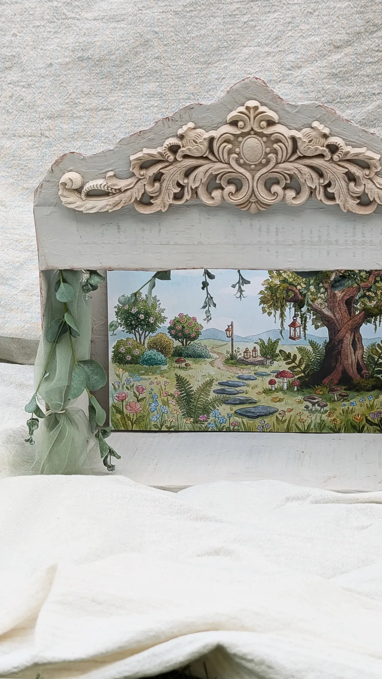 Handmade cardboard puppet theater decorated with woodland details, seasonal backdrops, and Little Linden characters on a small stage.