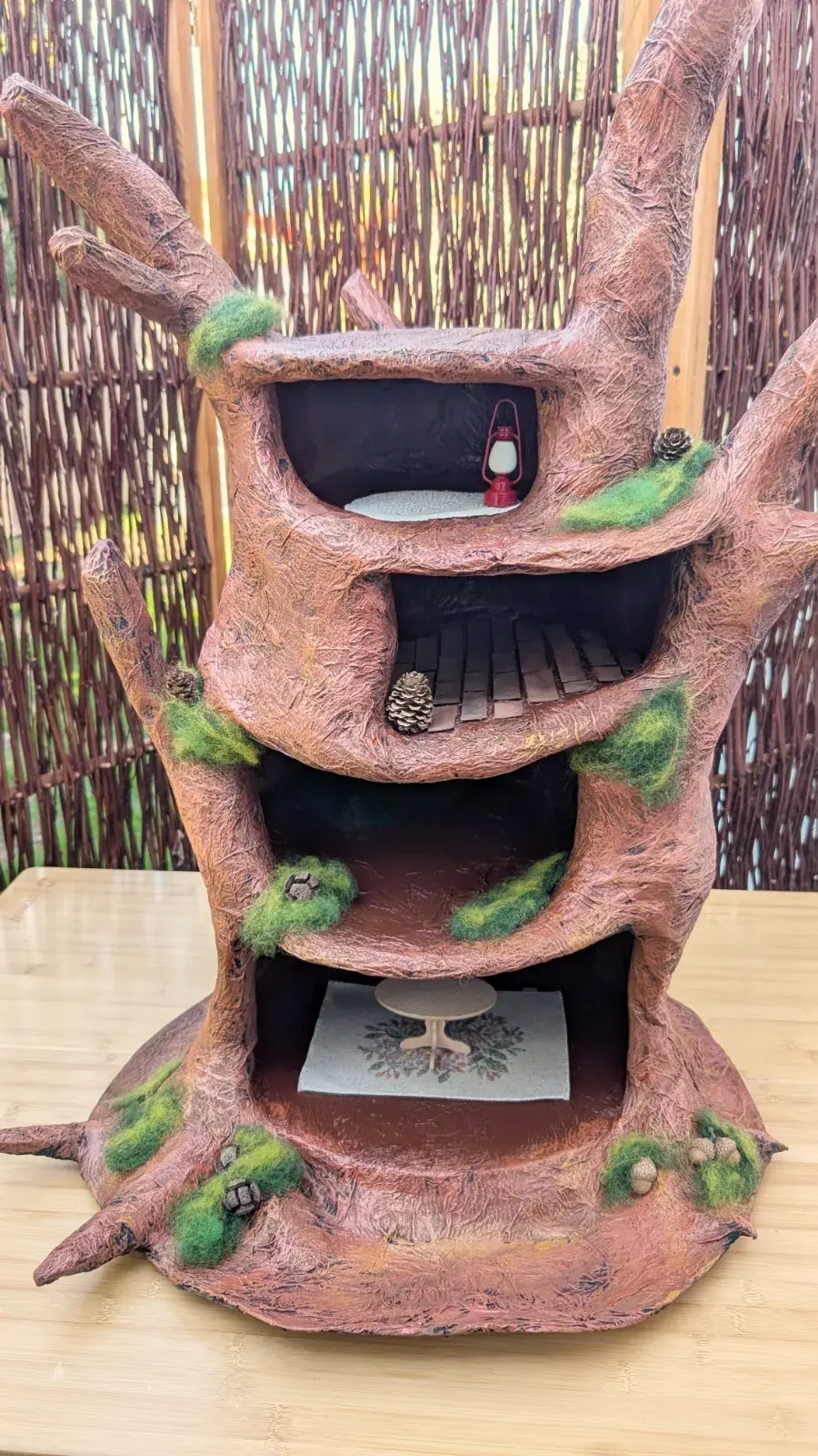 Handmade cardboard tree house inspired by an old woodland tree